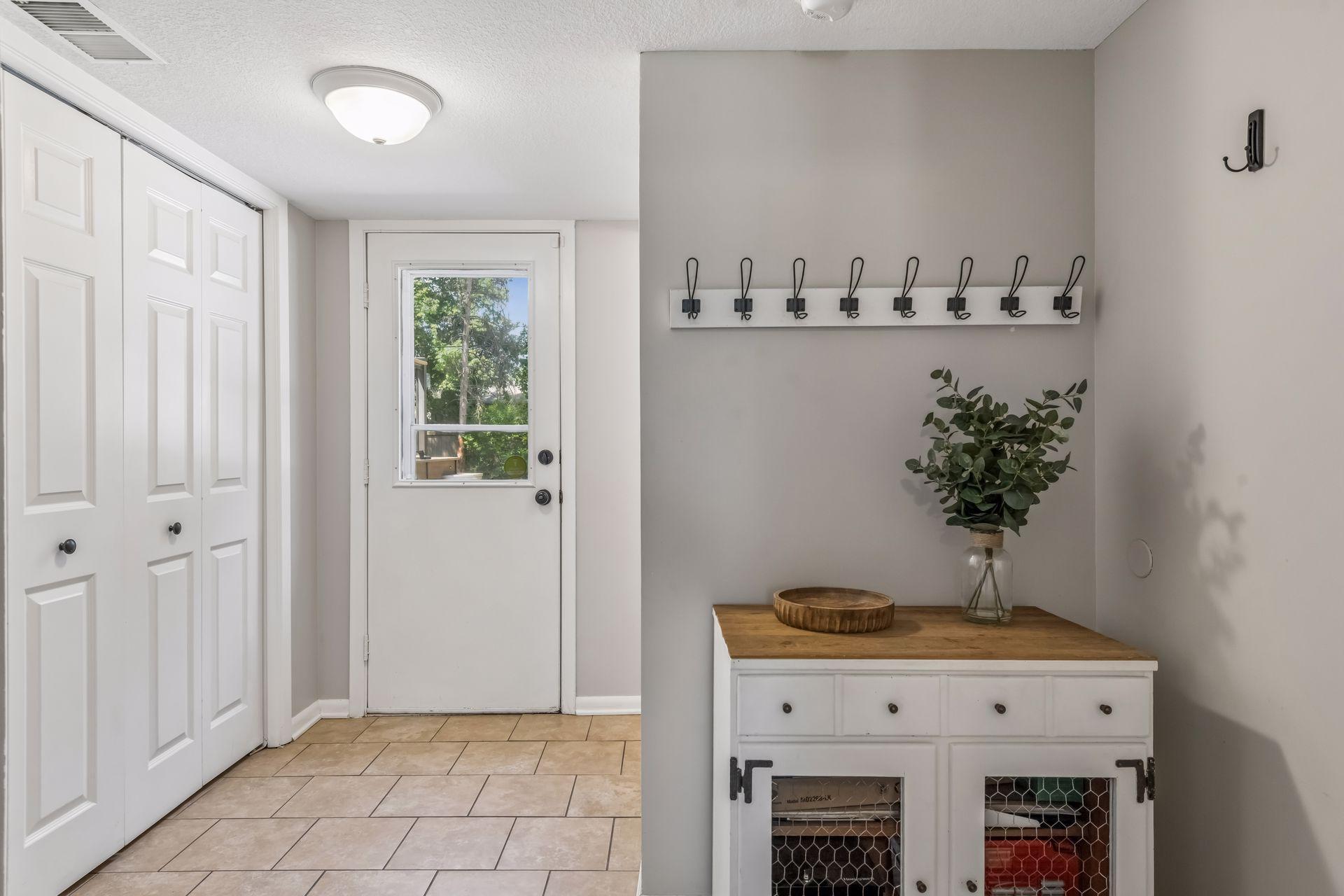 Just off the garage is 1/2 bathroom, coat closet and direct walkout access to backyard