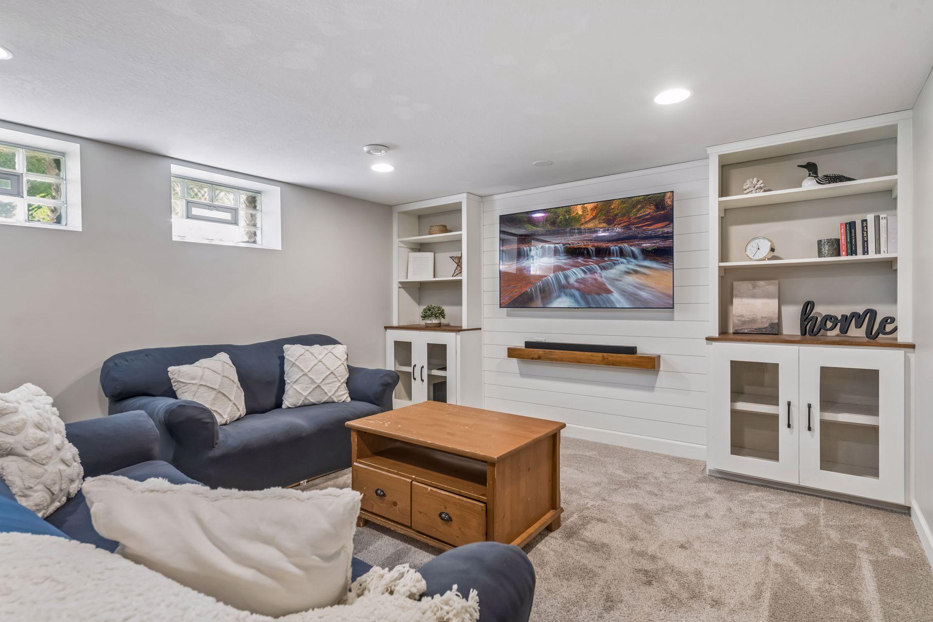 Built in shelving surrounds media space