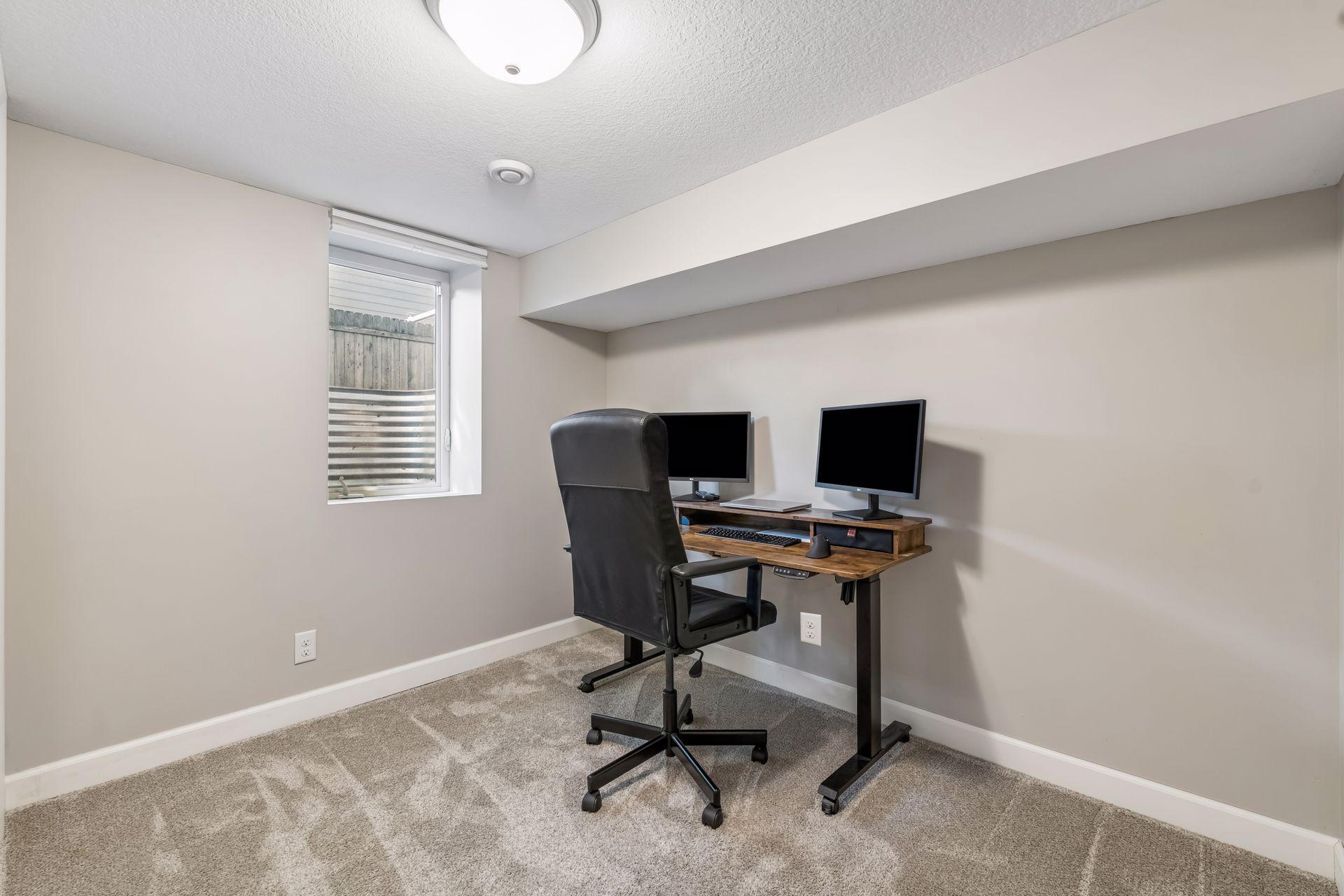 5th bedroom in lower level currently used as office space