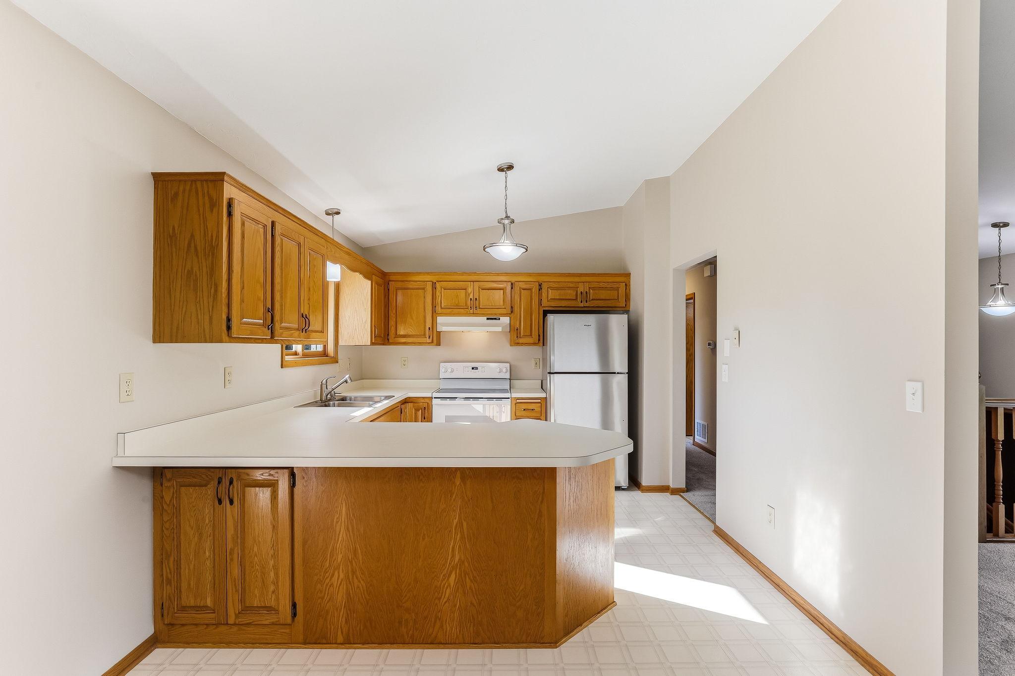 Kitchen features generous counter space and ample storage, offering a highly functional layout for cooking and organization.