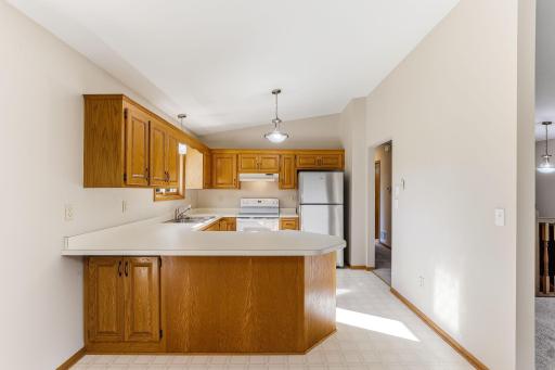 Kitchen features generous counter space and ample storage, offering a highly functional layout for cooking and organization.