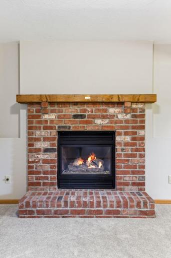 The gas fireplace brings effortless warmth and modern comfort to the family room.