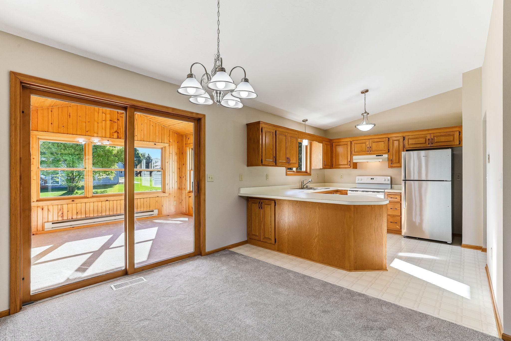 Bright, functional kitchen featuring a breakfast bar that offers additional seating and a perfect spot for casual meals.