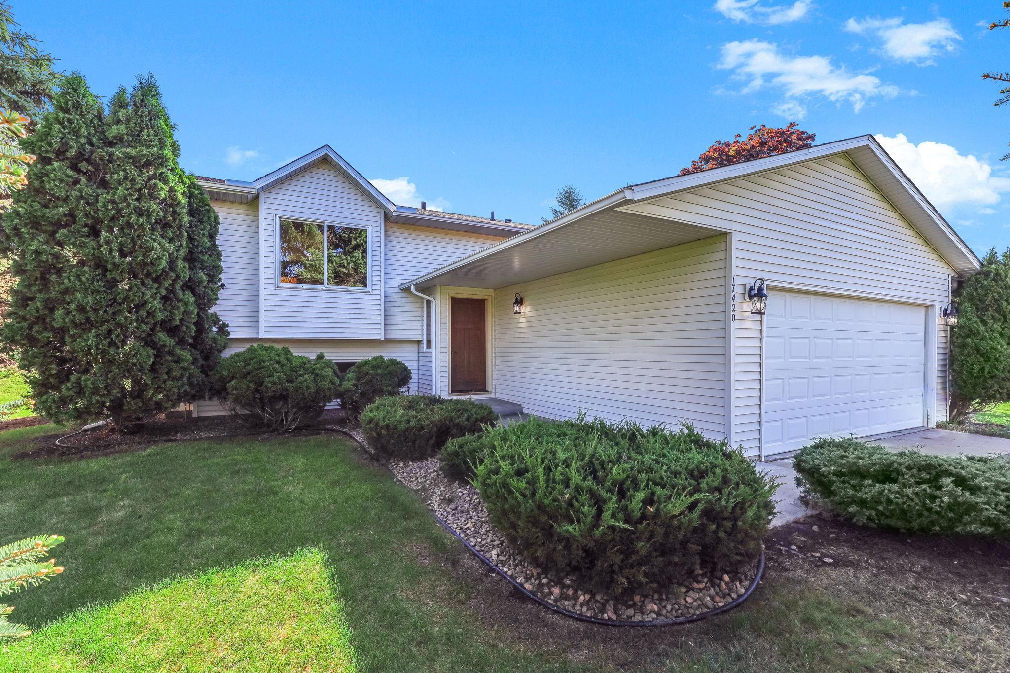 Great curb appeal with mature landscaping and a welcoming entry.