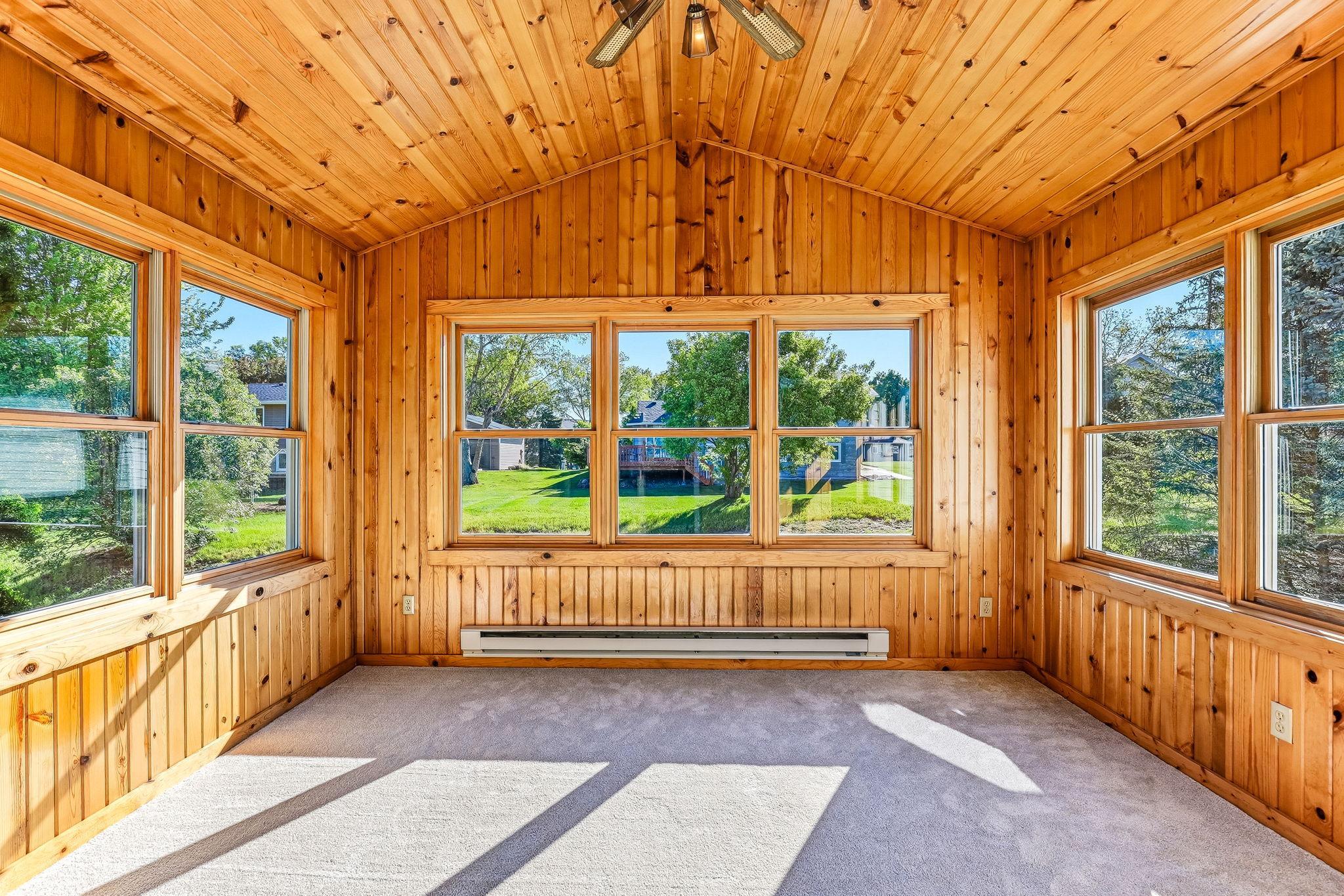 Charming sunroom with expansive windows that showcase outdoor views and make the space perfect for morning coffee or quiet afternoons.