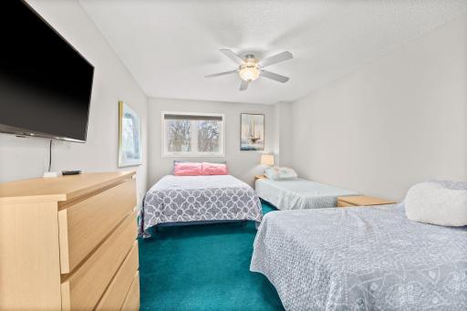 Upper bedroom #3 sleeps 4 with a queen and 2 twins.