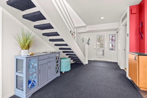 Spacious open entry with front hall closet for shoes and coats.