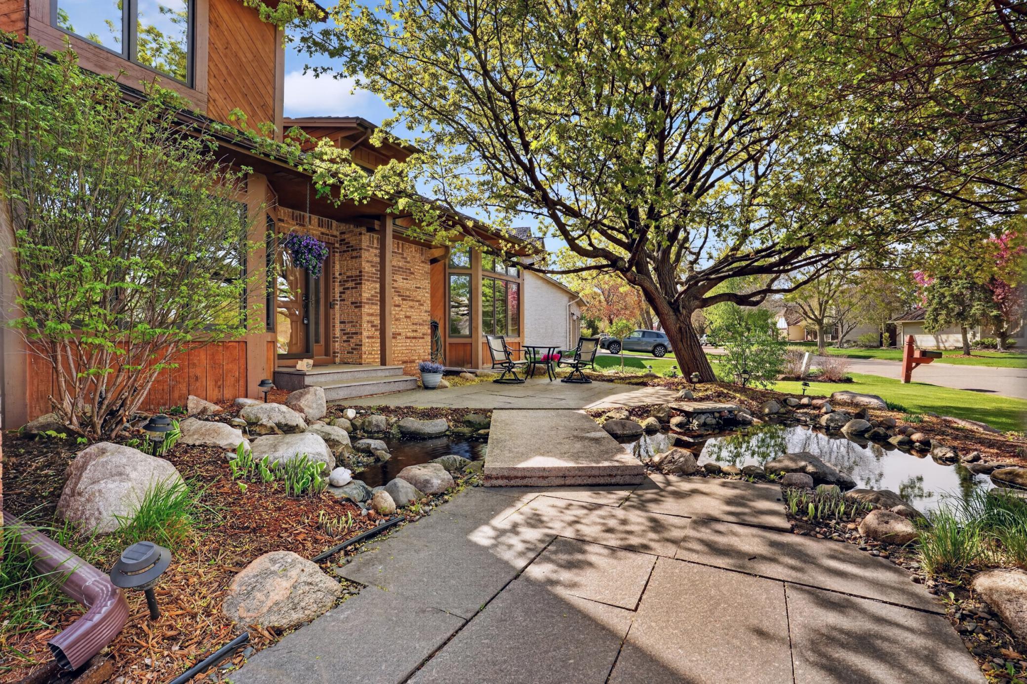 Granite walkway with inviting koi pond