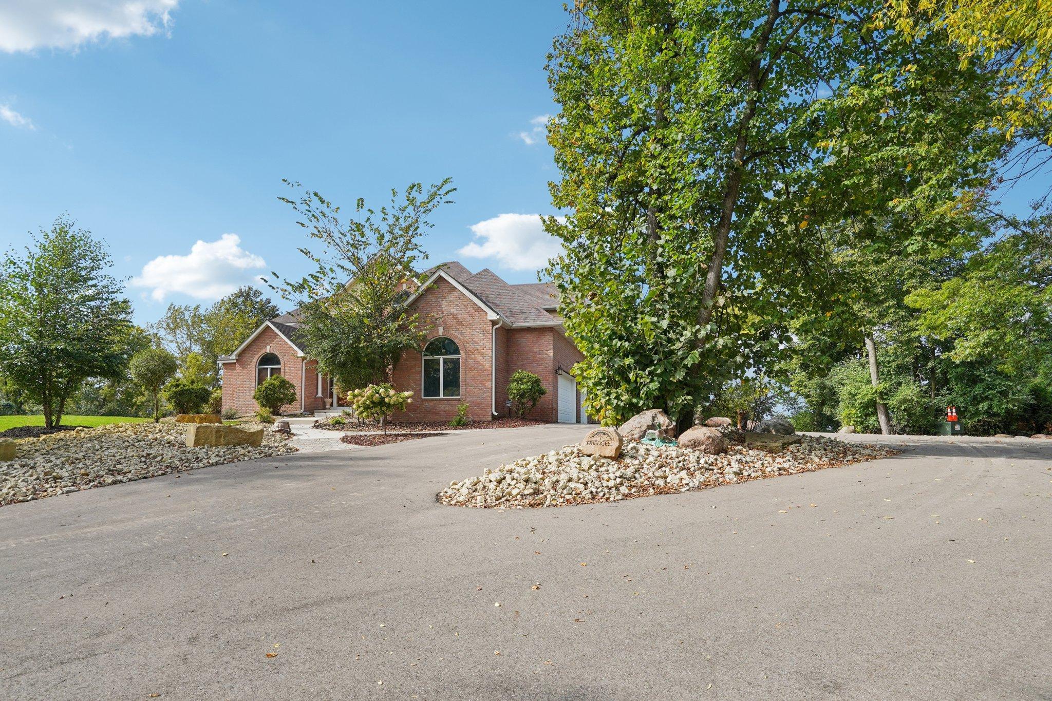 The longer private driveway was built to city road grade standards to allow convenient access for garbage trucks to make their pick up next to the home.