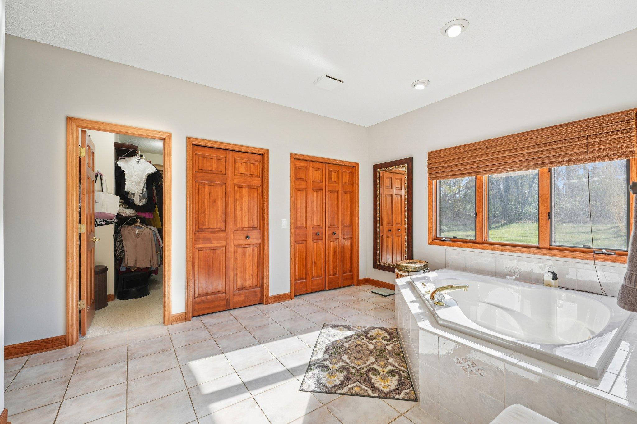 This ensuite provides ample closet and storage space with dual closets.