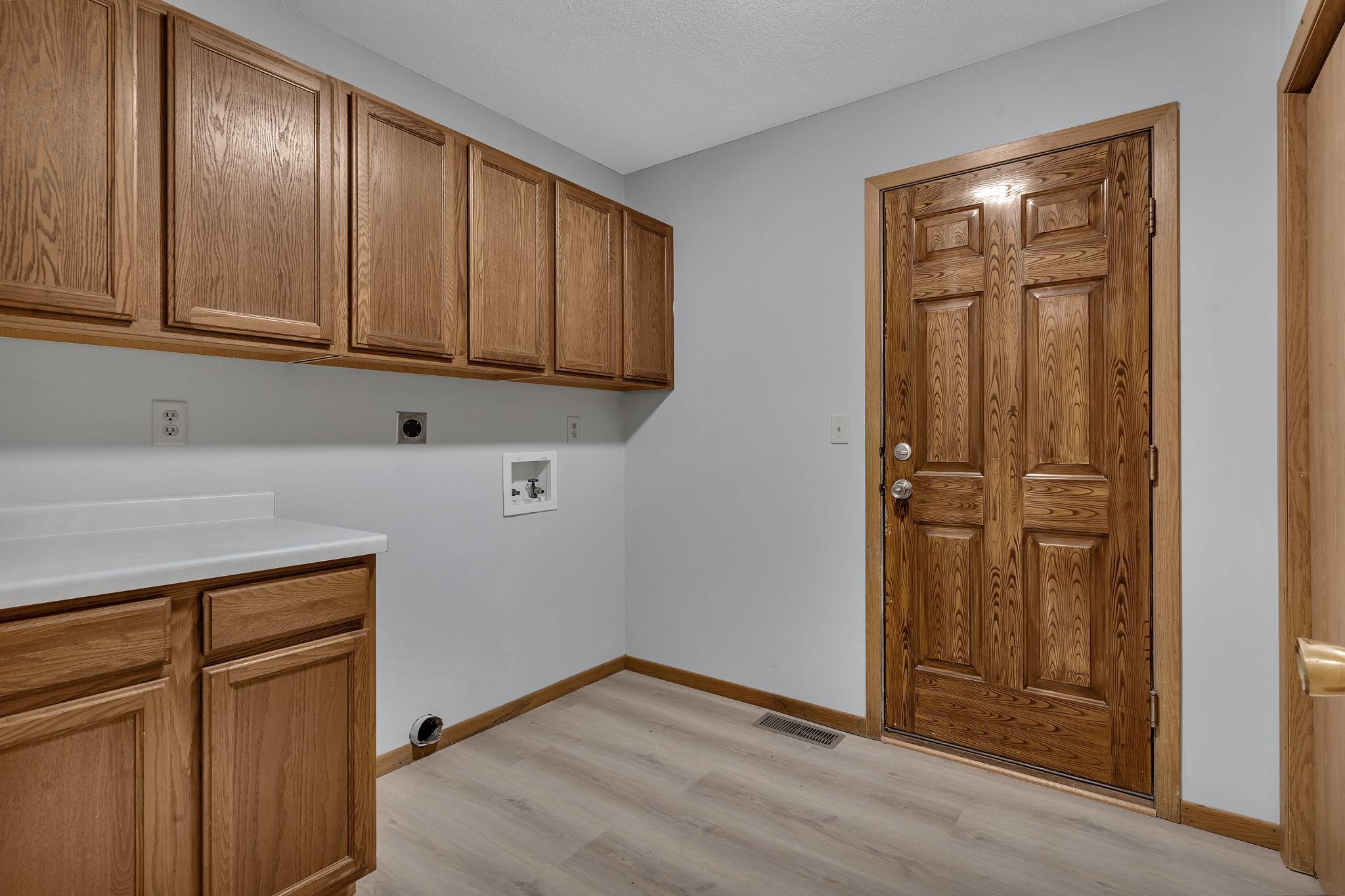 Main level laundry/mudroom with door to two car garage!
