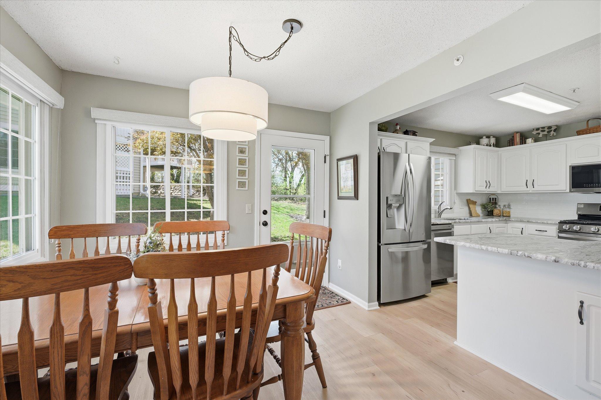 Dining area just off the kitchen with large windows providing great natural light and backyard views.