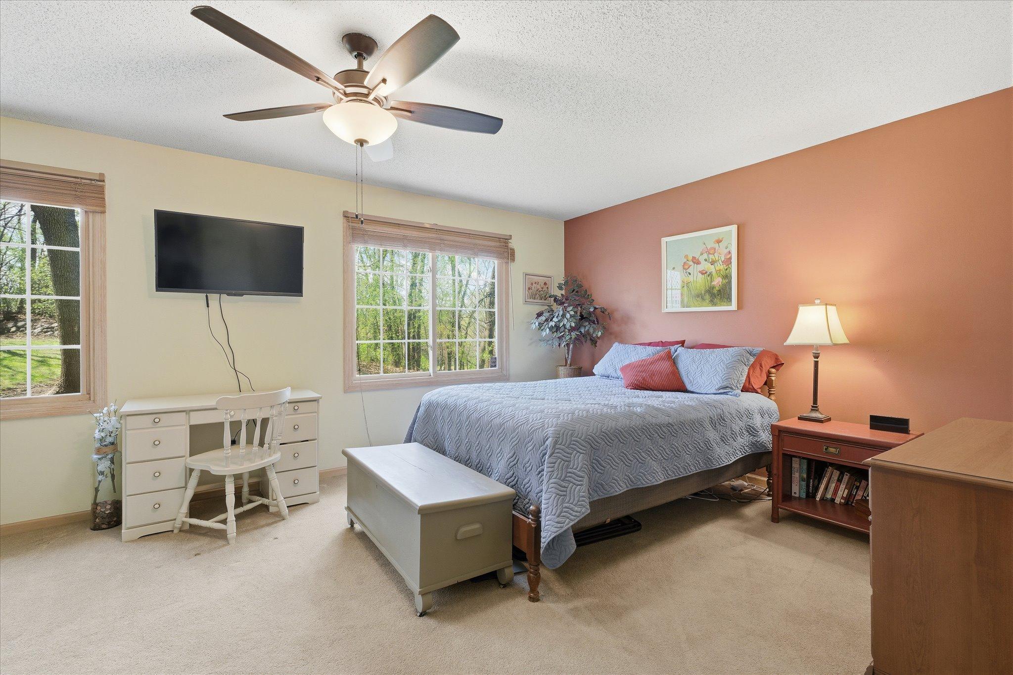 Bright and comfortable primary suite with a walk-in closet.