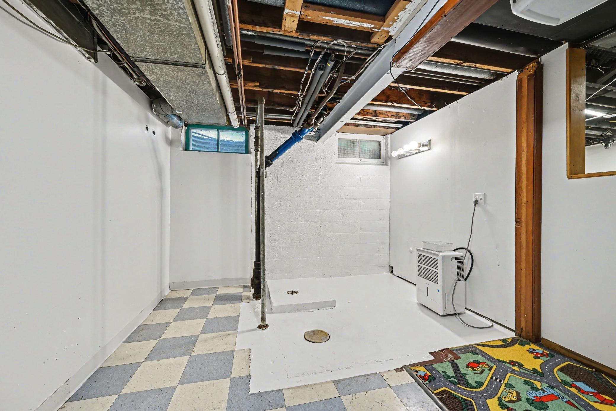 Plumbing connections for future 3rd bathroom - lower level - below vanity lights in wall would be the sink plumbing.