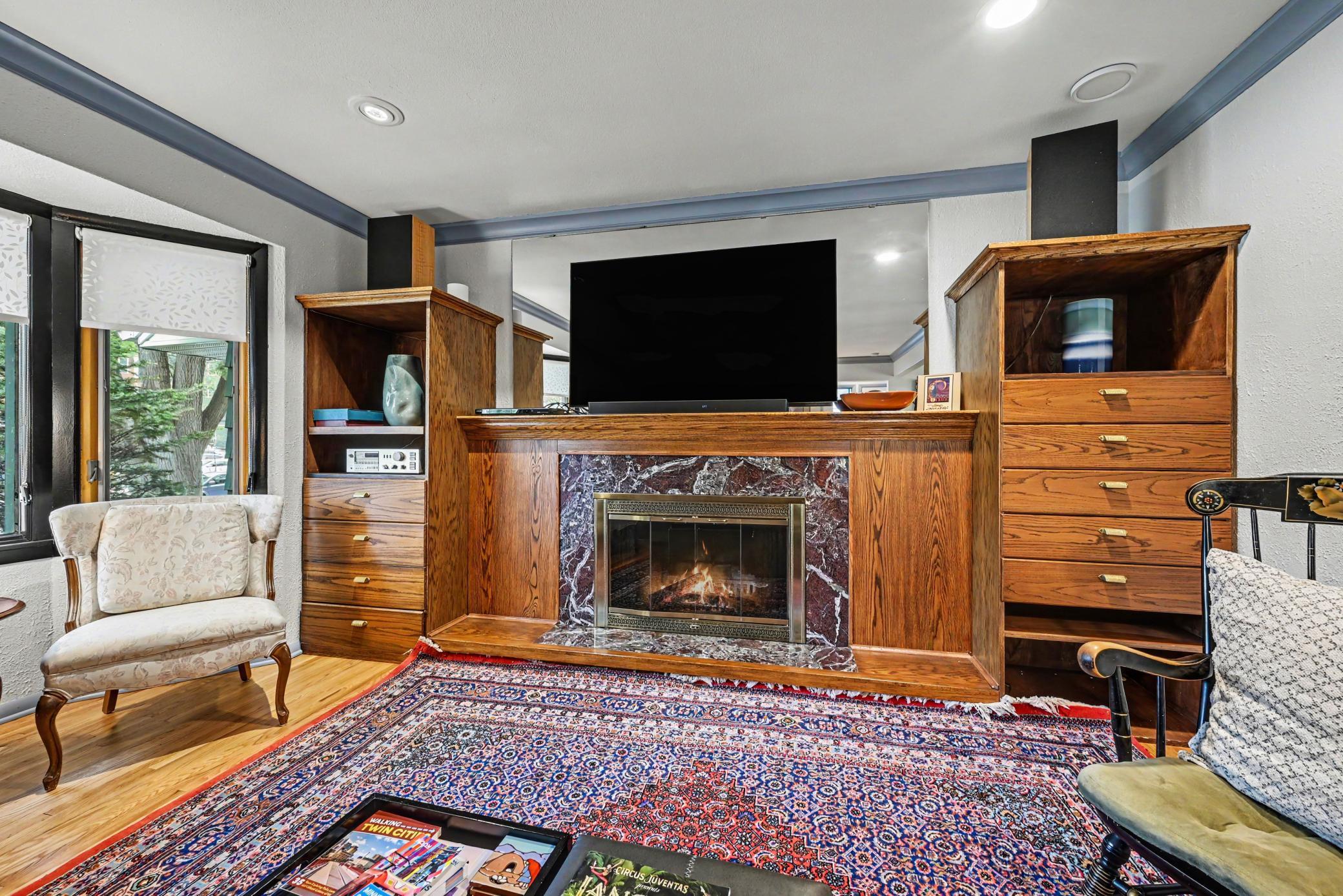 Living room w/ wood fireplace.