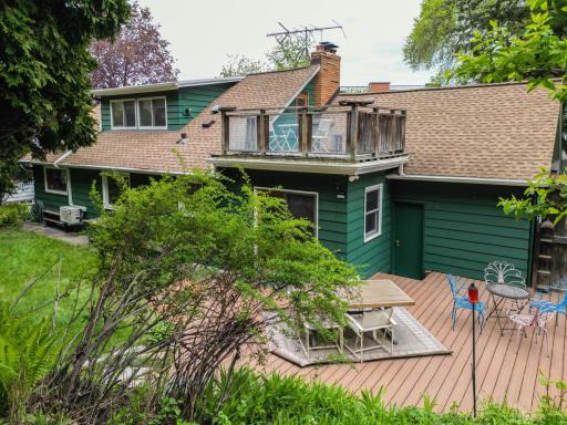 Back exterior with both upper and lower deck. dormer for extra light and view from upper suite.