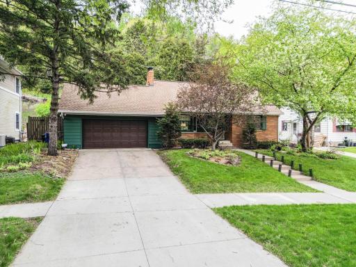 Front with two car attached garage and room to park cars in driveway !