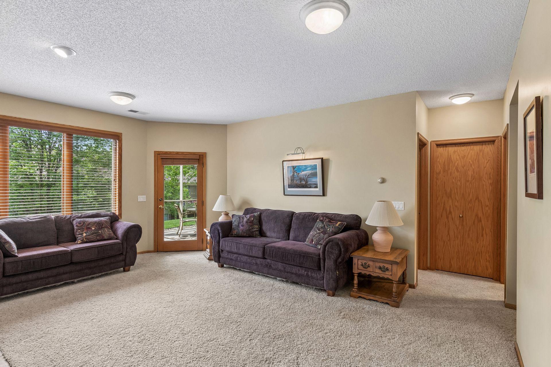 Family room with access to lower screened in porch and patio area