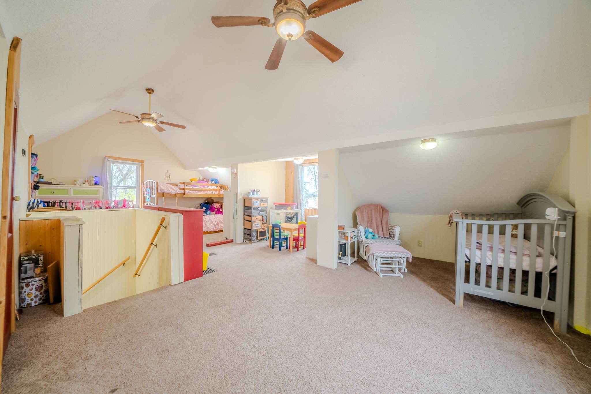 Double ceiling fans in upper bedroom