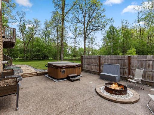The walkout family room leads to a fire ring and an inviting hotub
