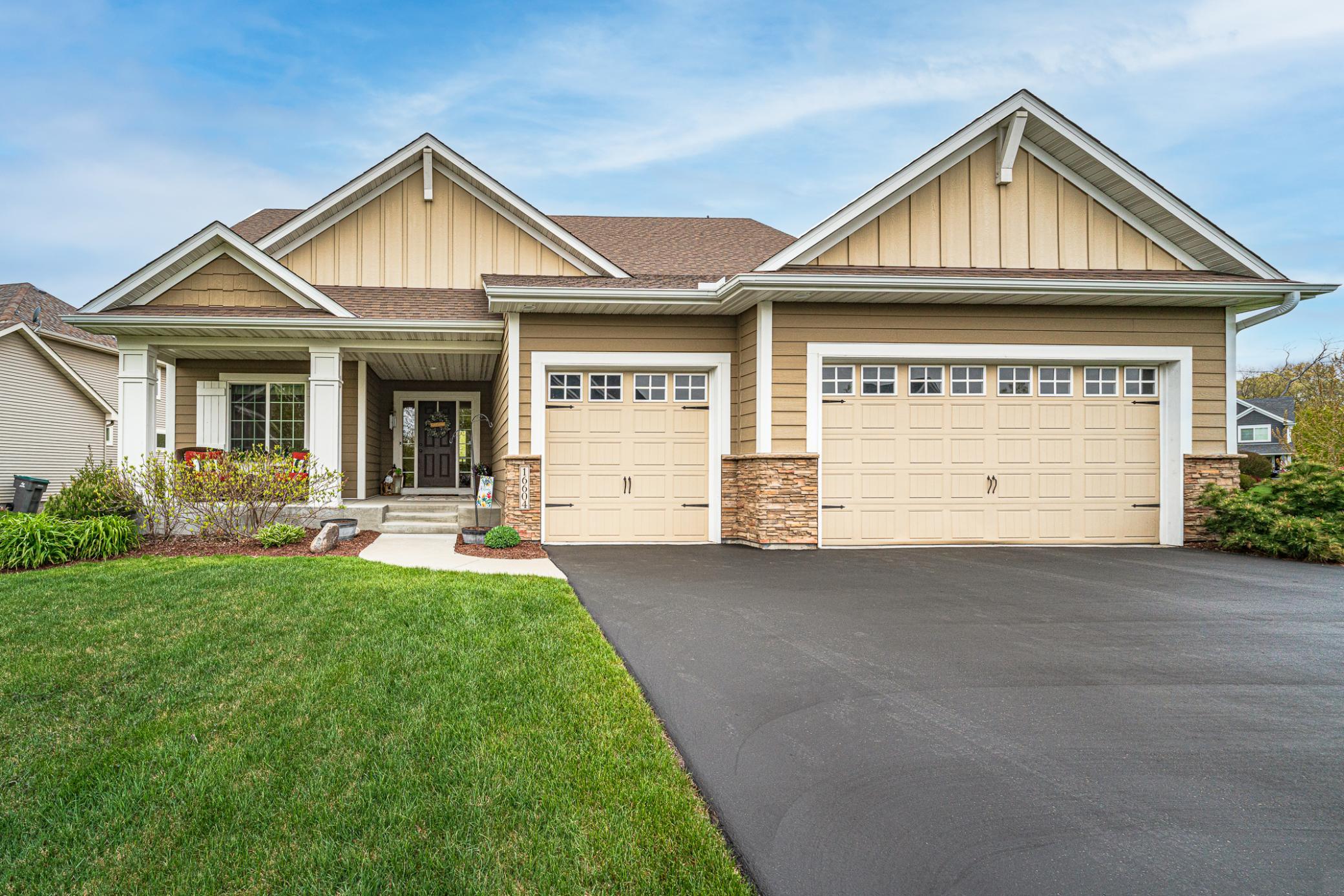 You’ll feel right at home in this inviting custom-built rambler that showcases warm woods and lots of natural light in the Markley Lake Woods neighborhood!