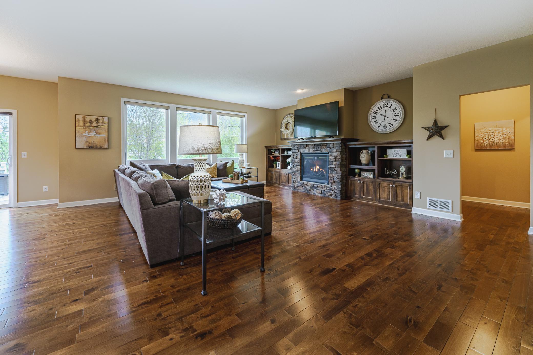 Birch hardwood floors run throughout the main floor living room, which also features 9-foot ceilings with recessed lighting.