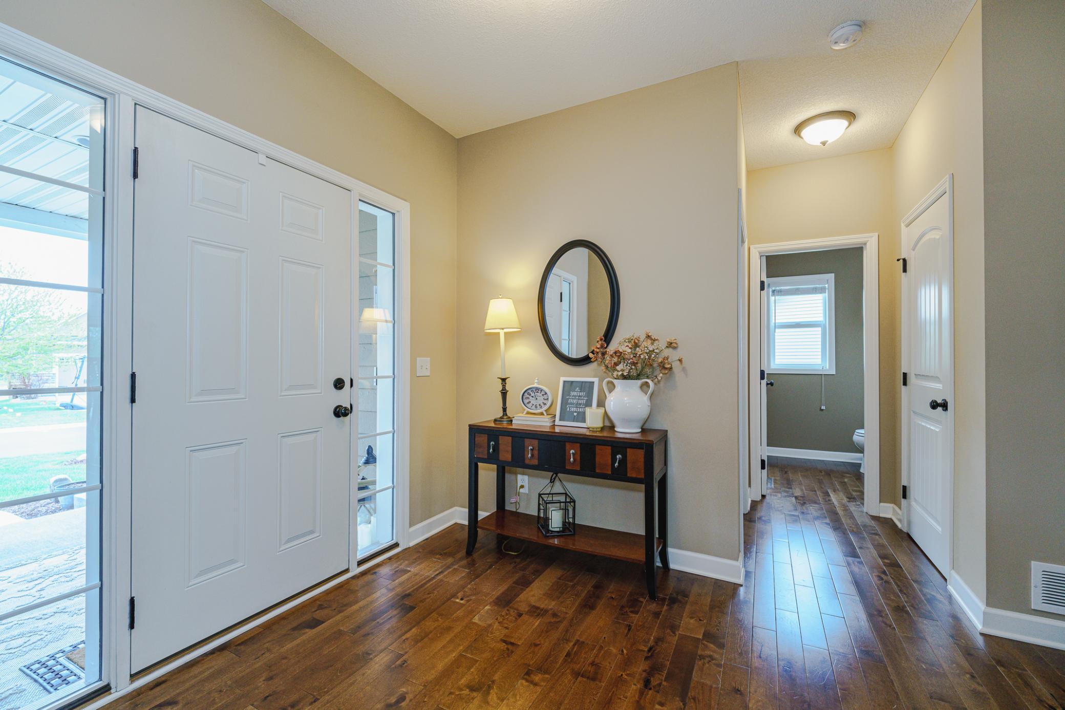 A half bath and coat closet are conveniently near the front door.