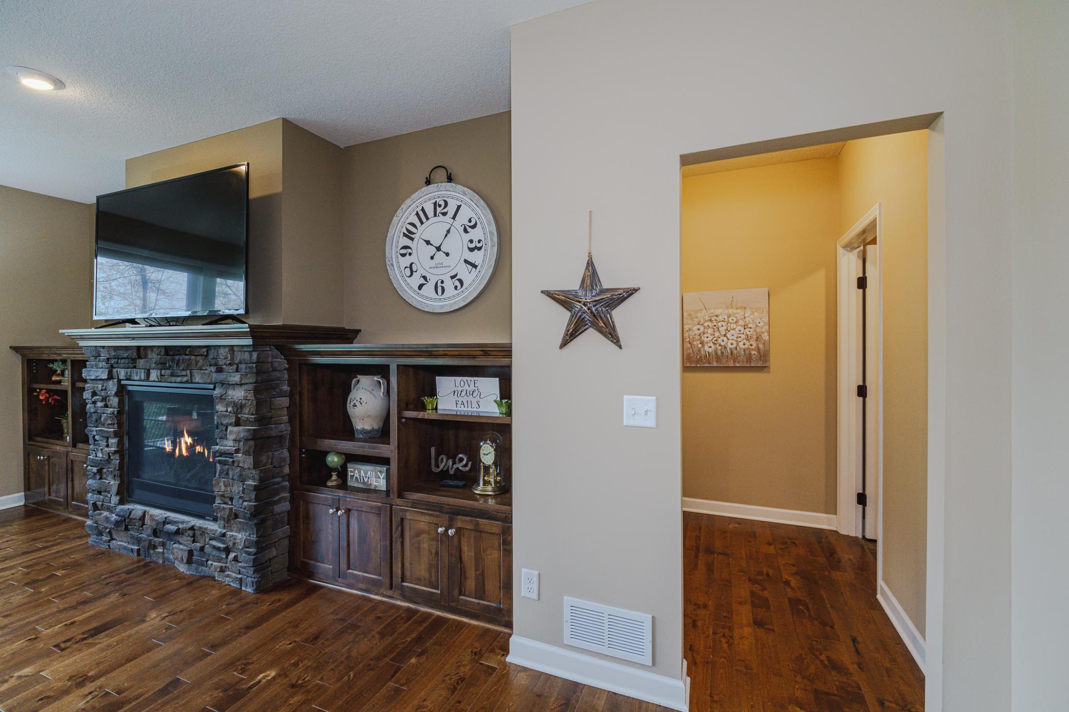 Beyond the family room lies the laundry room, and the doorway to the primary suite.