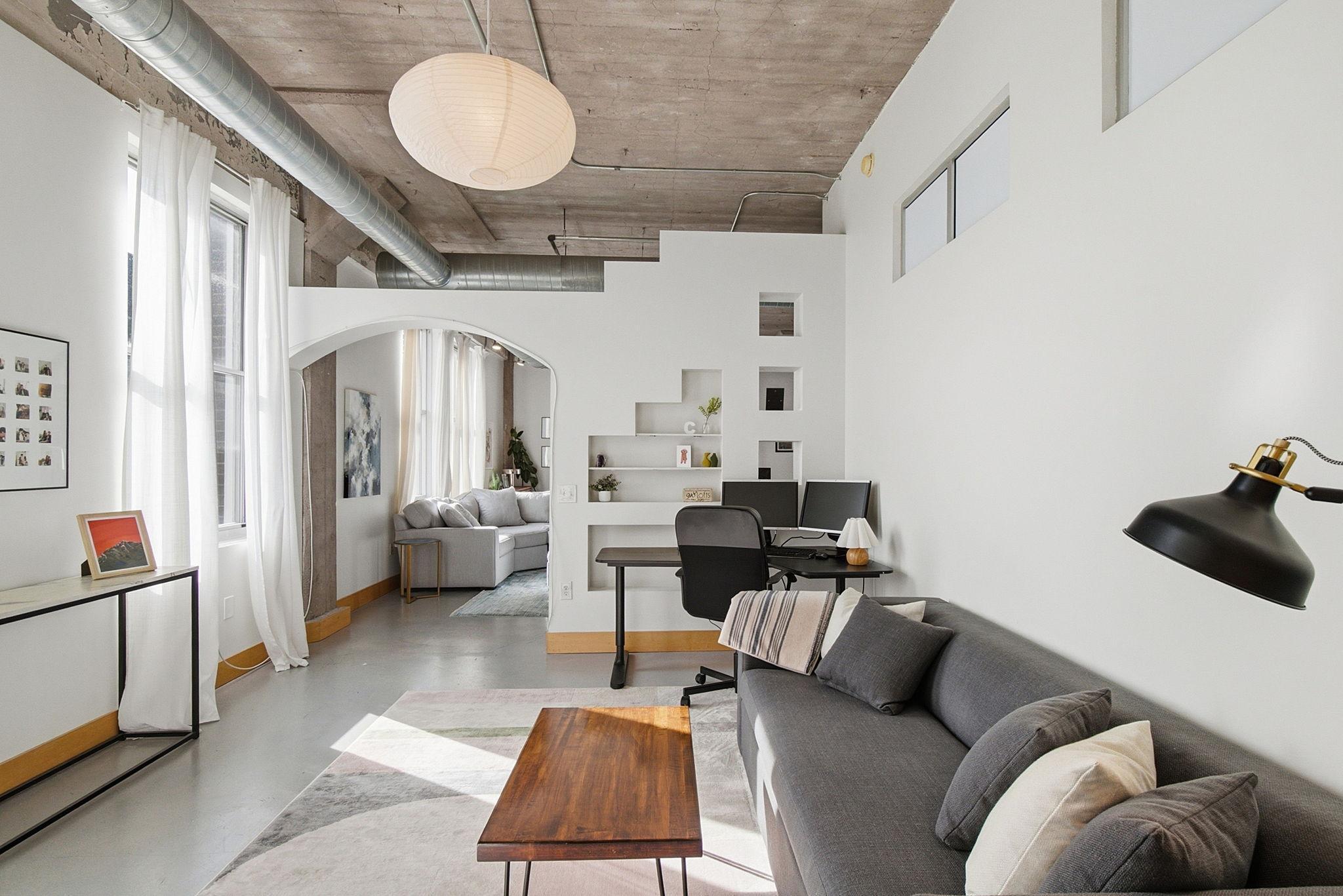 Loft style second bedroom allows for open concept living.