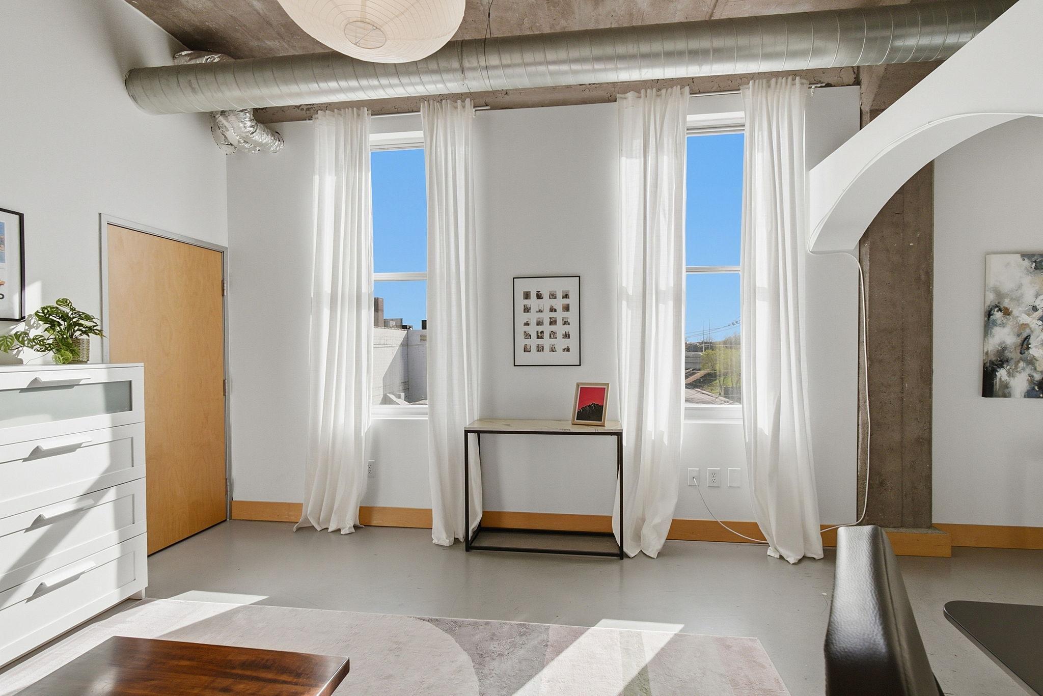 Large windows in the second bedroom.