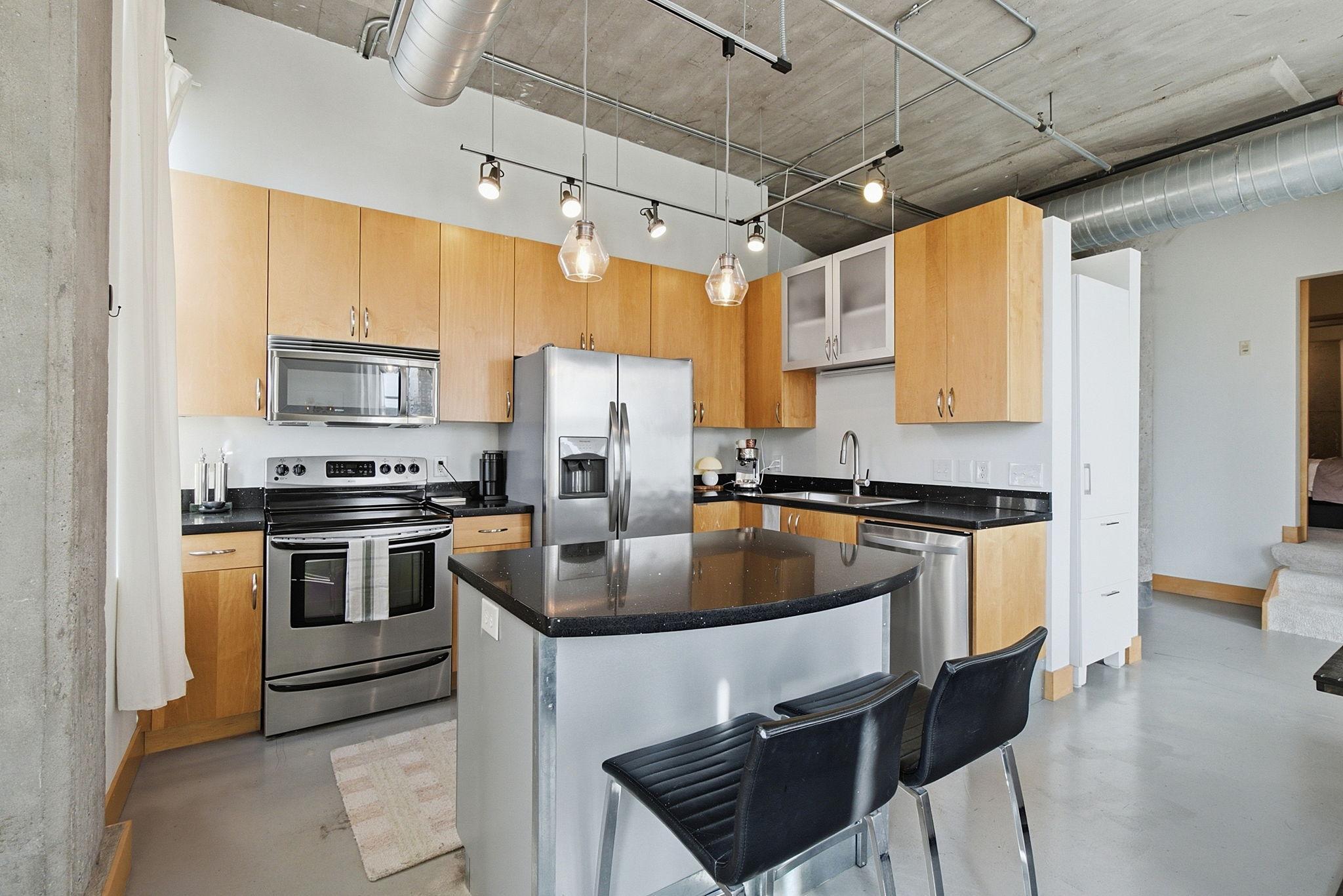 Beautiful kitchen with stainless steel appliances.