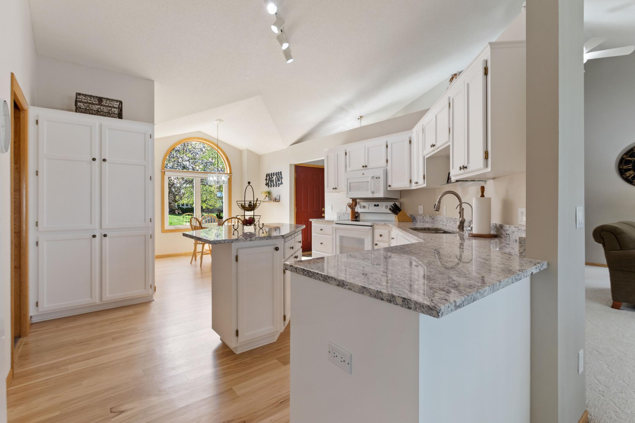 Refreshed Kitchen includes newer flooring, granite tops and vaulted ceilings