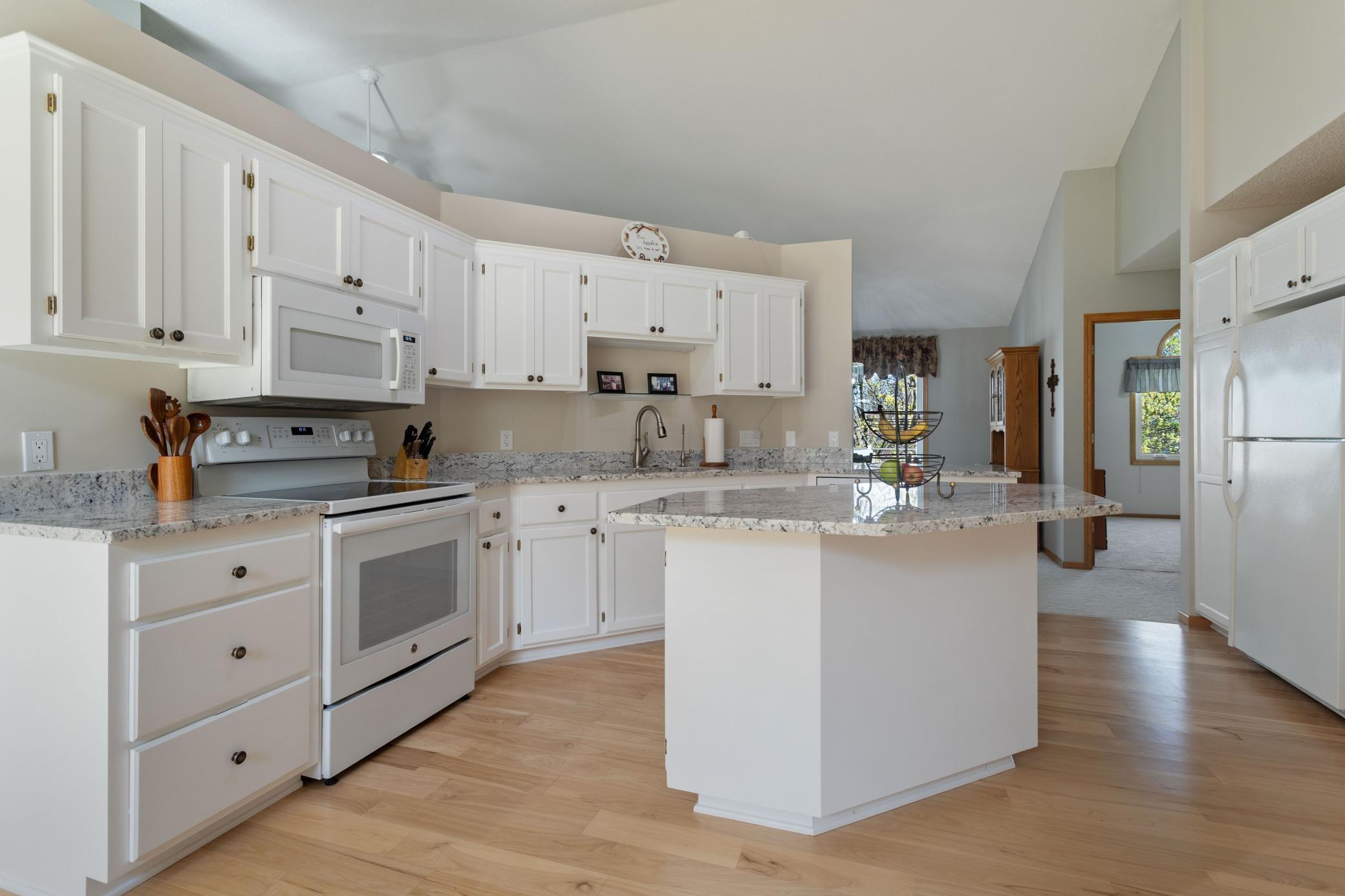 Center island with overhang allows for additional seating.