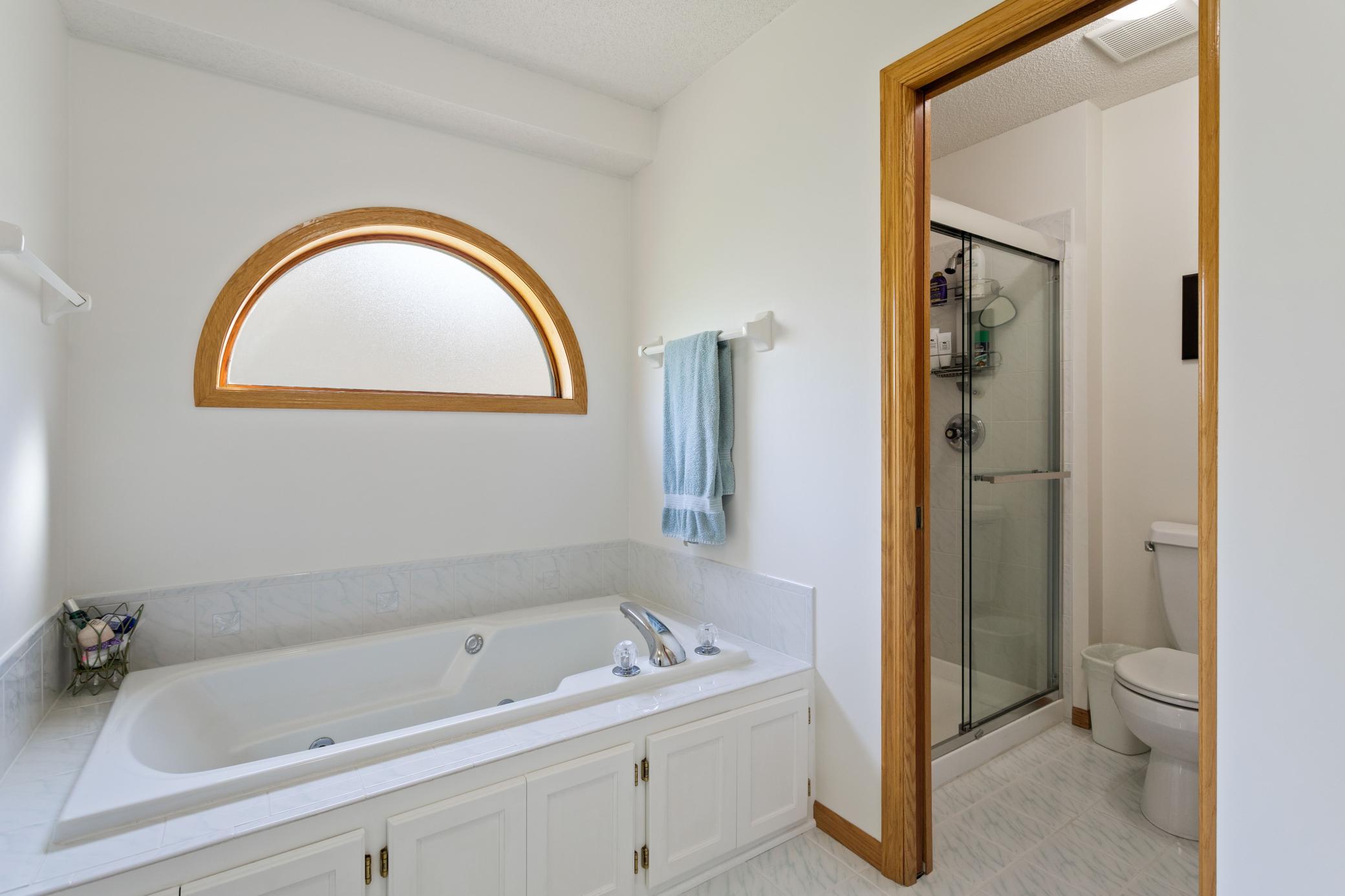 Owners Suite Bath with jetted tub, Plus separate room for stool and shower