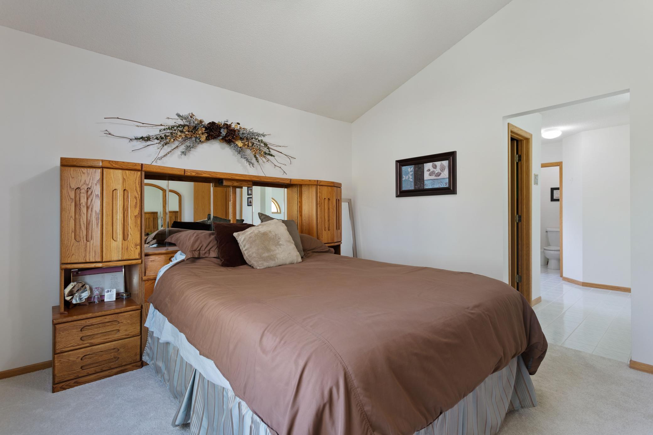Vaulted Owners Suite with ceiling fan