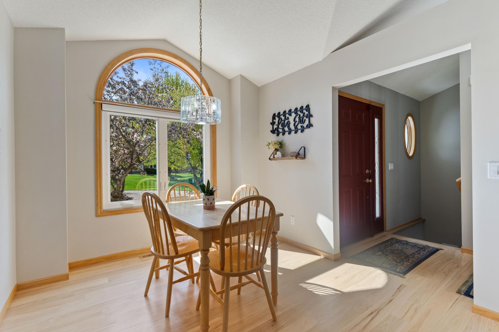 Additional eating space at this dinette with a vaulted ceiling, and larger 1/2 round transom above the 2-wide window