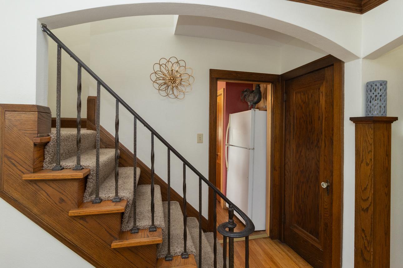 Entry to the kitchen is past the staircase