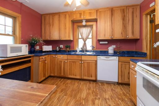 Open kitchen with plenty of counter space & windows