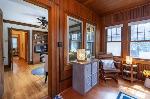 The sunroom offers a fantastic cozy space and opens seamlessly into the inviting living room