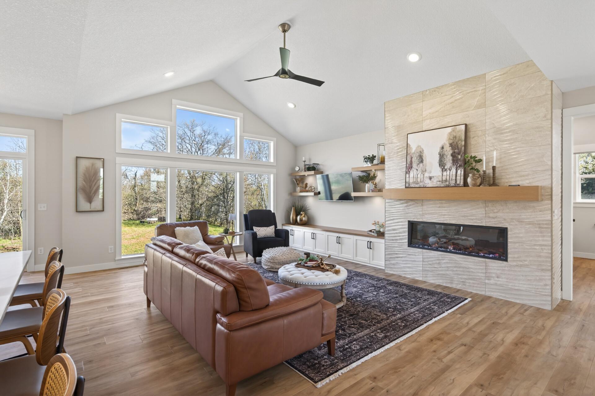 The main level offers an open-concept layout filled with natural light and a vaulted ceiling in the great room