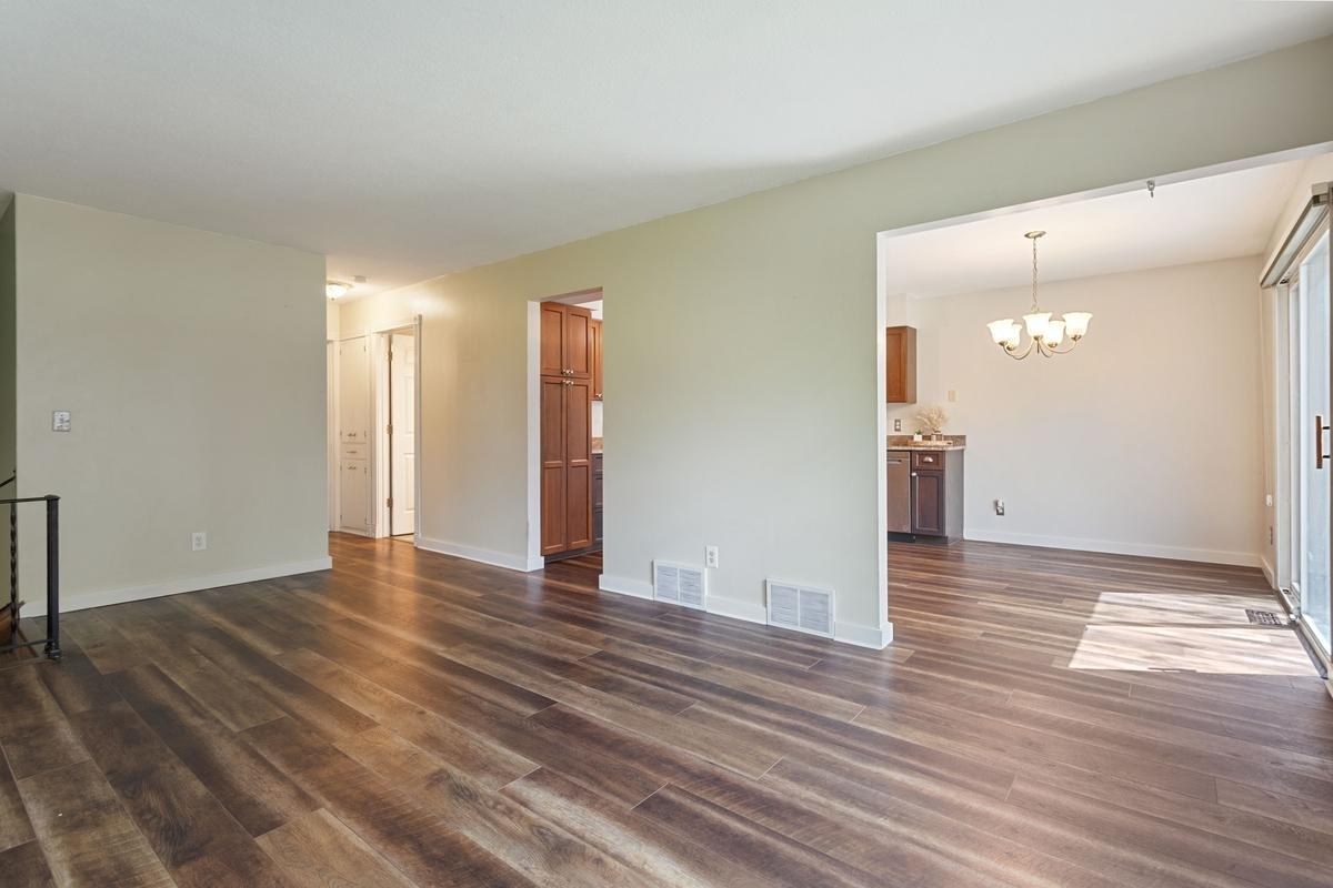 The living room is open to the kitchen and dining areas for easy flow. Perfect for entertaining!