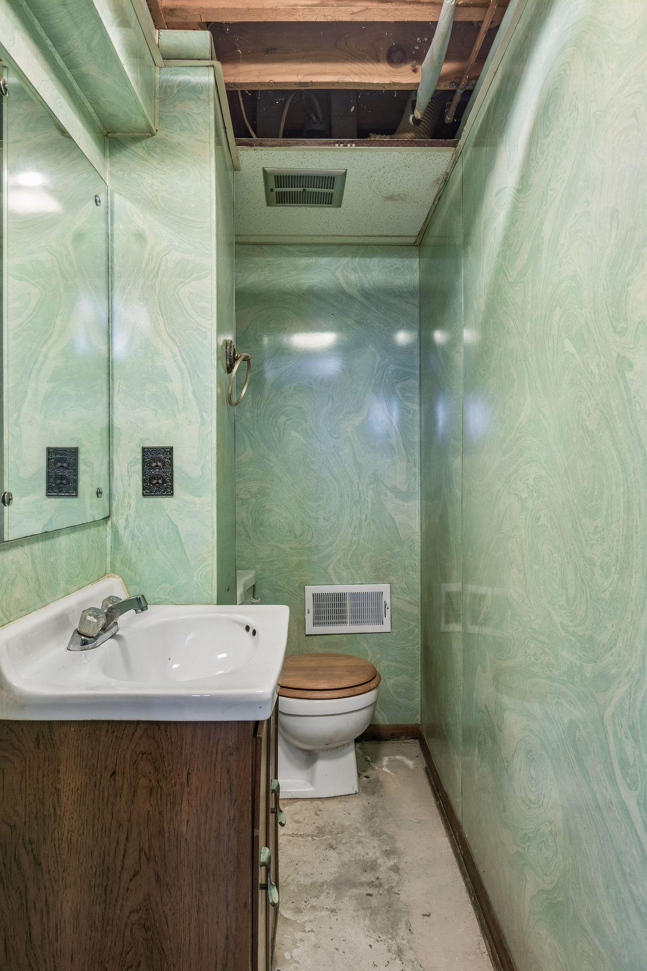 Current lower level 1/2 bath.