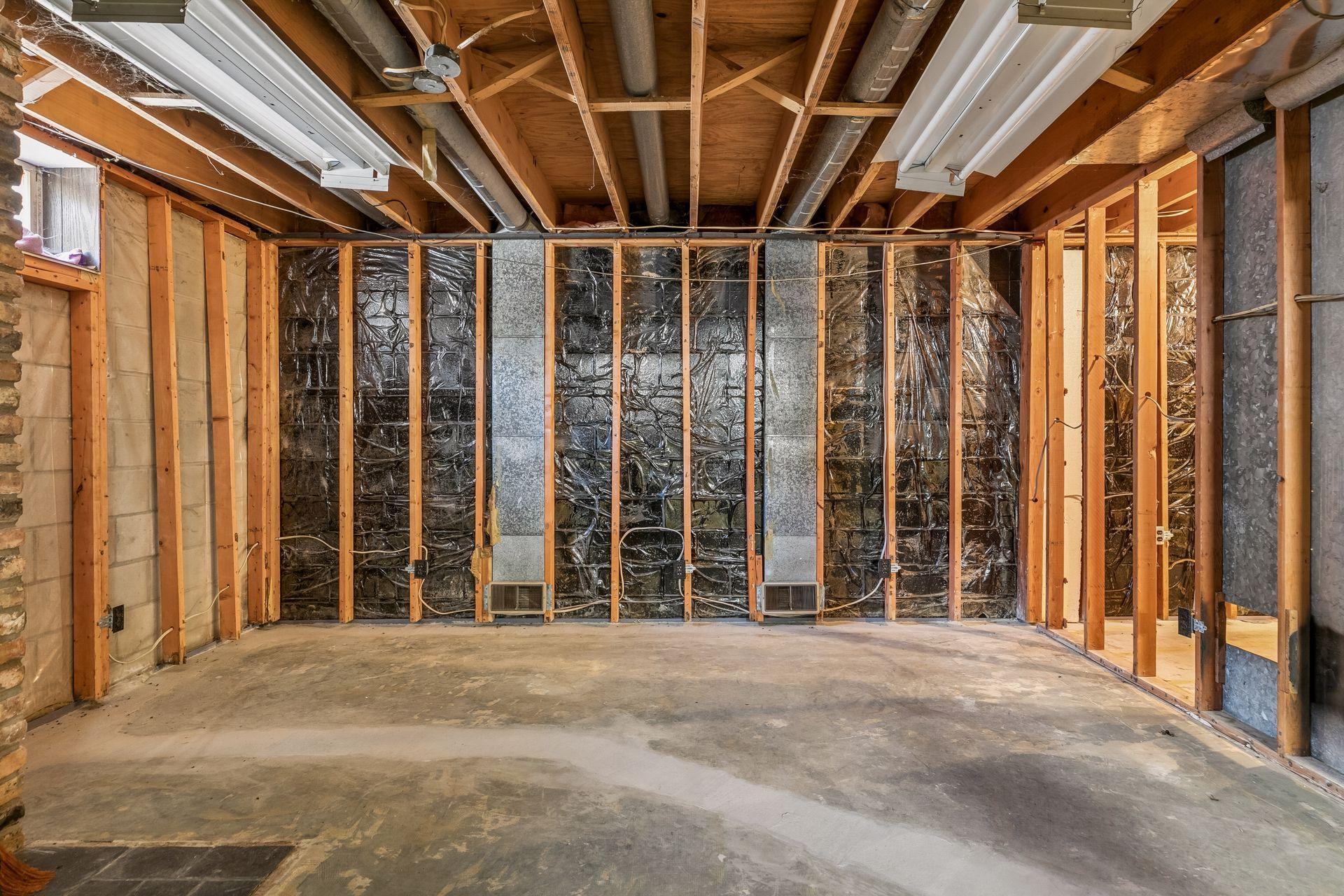 Former family room space. Electrical and HVAC already installed, missing sill/sole plate.