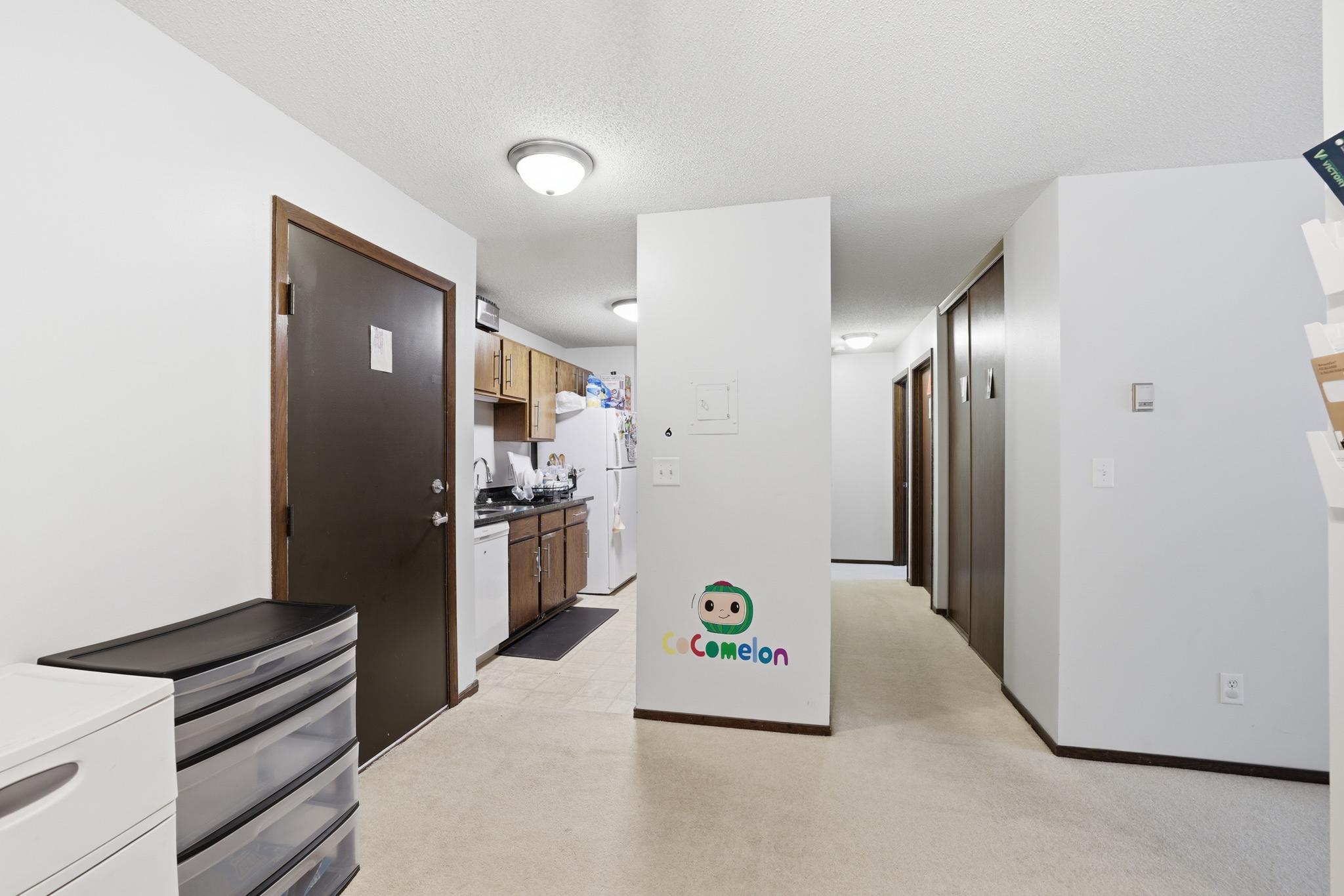 View from dining towards kitchen and hallway to bedrooms