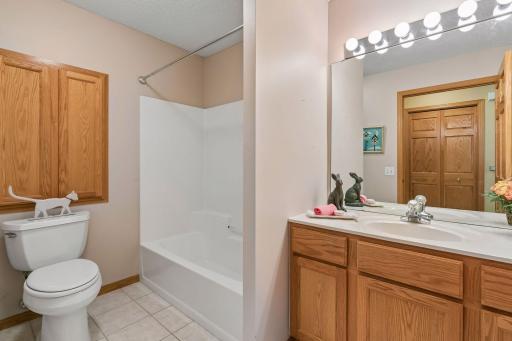Hallway to second bedroom features a full bath