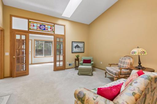 French doors in living area lead to 4-season porch