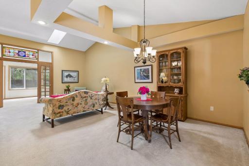 Vaulted ceilings and skylight in the spacious living/dining area