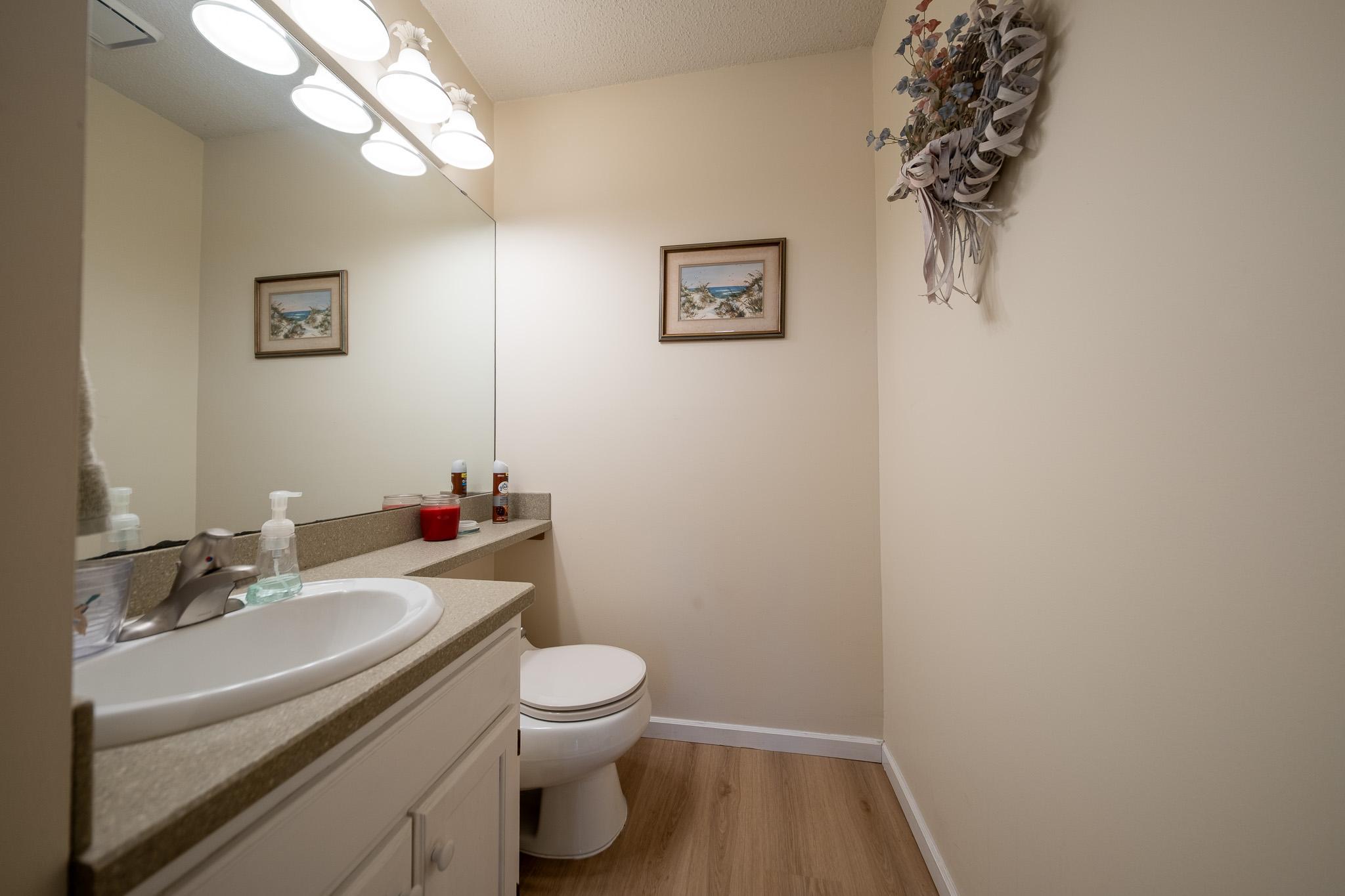 Guest bathroom on the main level located near the kitchen and mud room
