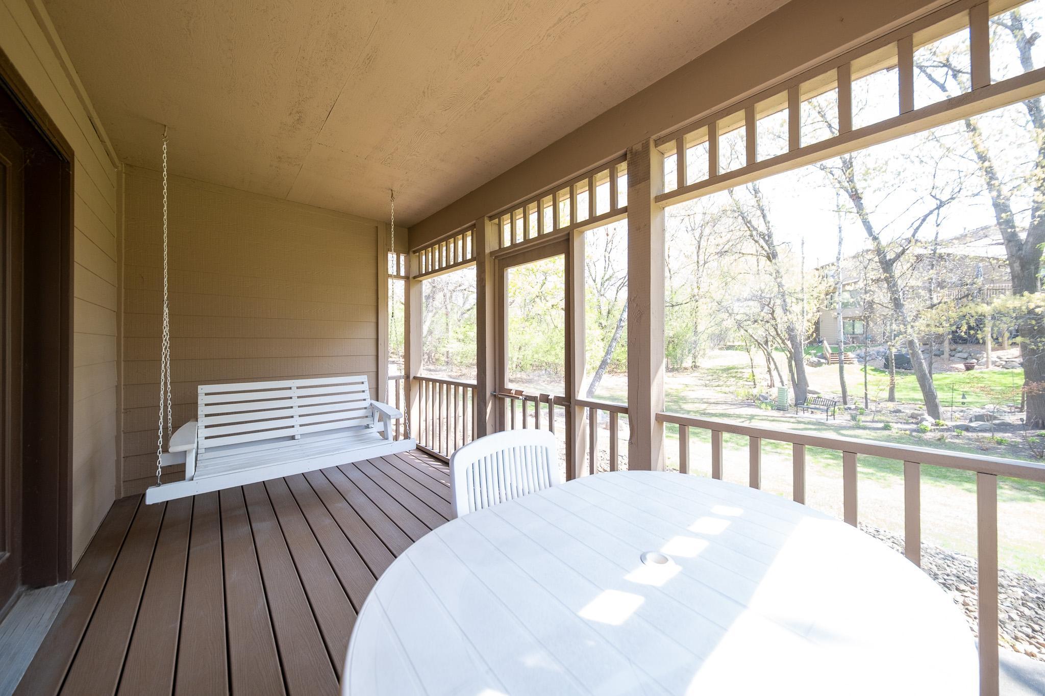 Screened in porch equipped with swing