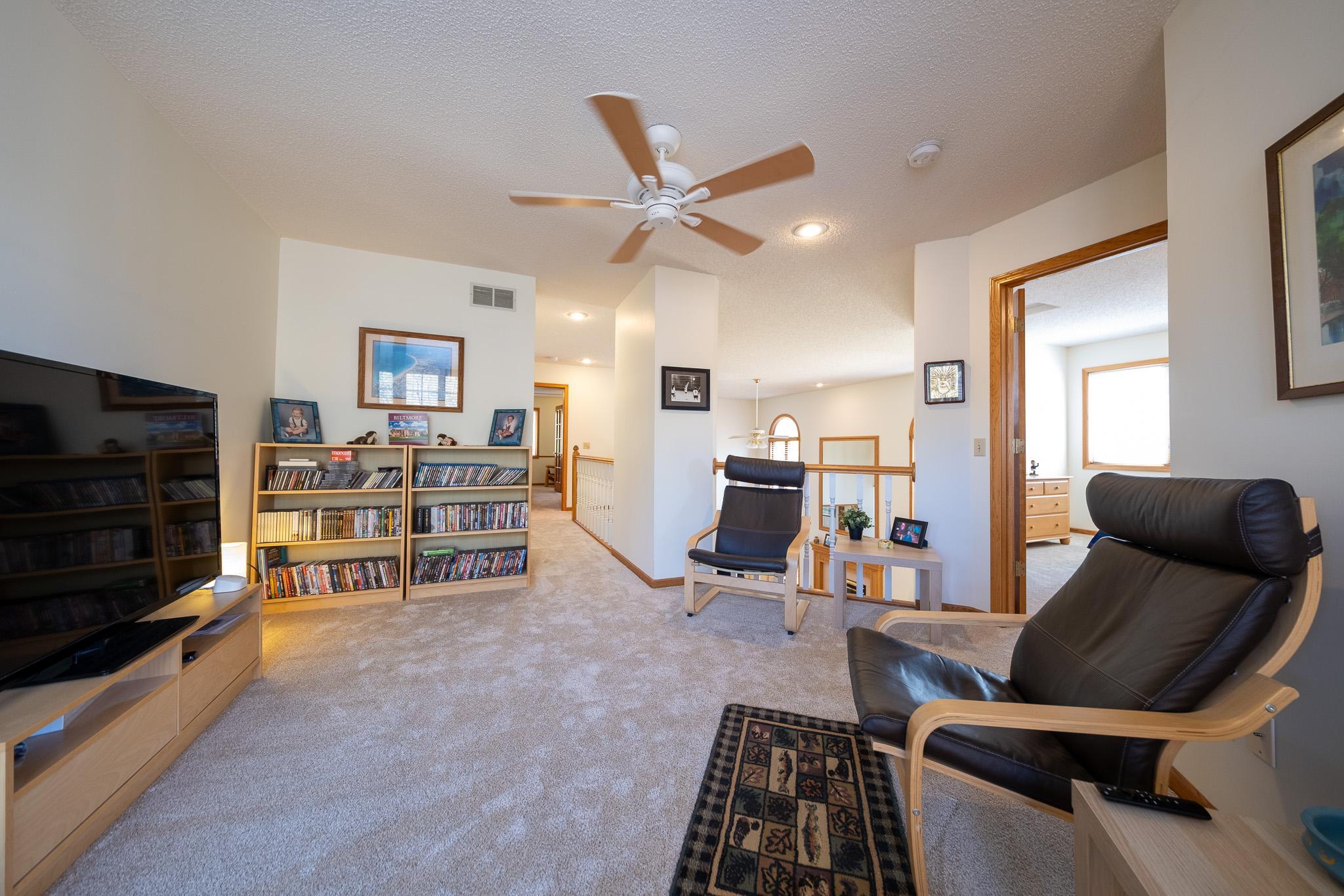 Two bedrooms located upstairs, one is towards the back of this photo, and the other is off to the right. Gives for plenty of separation and privacy
